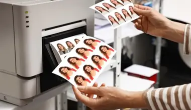 Worker printing custom passport photos